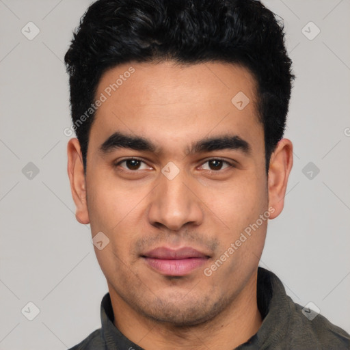 Joyful latino young-adult male with short  black hair and brown eyes