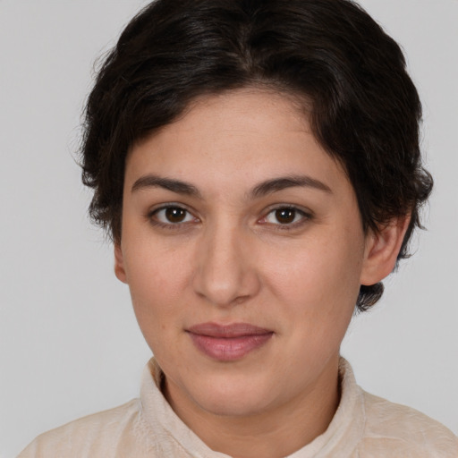 Joyful white young-adult female with medium  brown hair and brown eyes