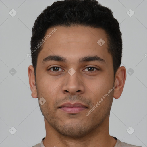 Neutral latino young-adult male with short  black hair and brown eyes