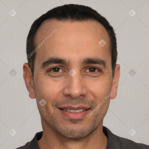 Joyful white young-adult male with short  black hair and brown eyes