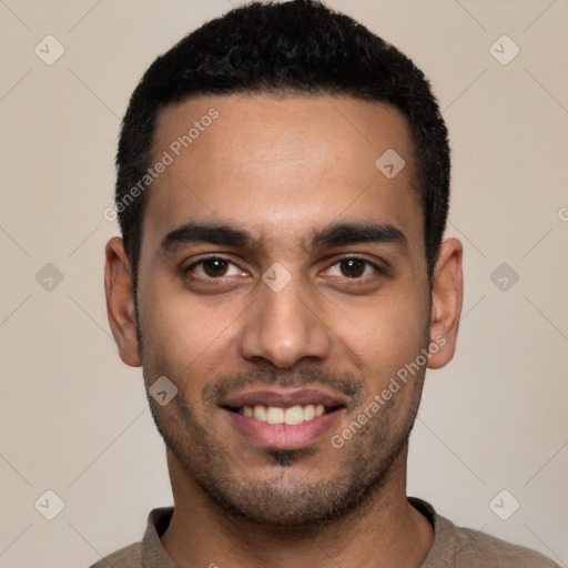 Joyful latino young-adult male with short  black hair and brown eyes
