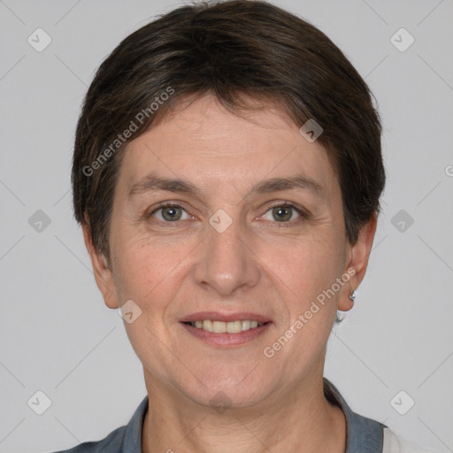 Joyful white adult female with short  brown hair and brown eyes