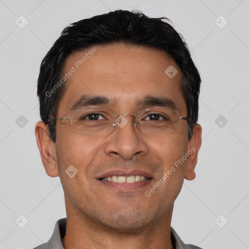 Joyful white adult male with short  black hair and brown eyes