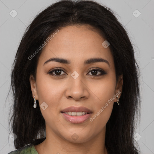 Joyful latino young-adult female with long  brown hair and brown eyes