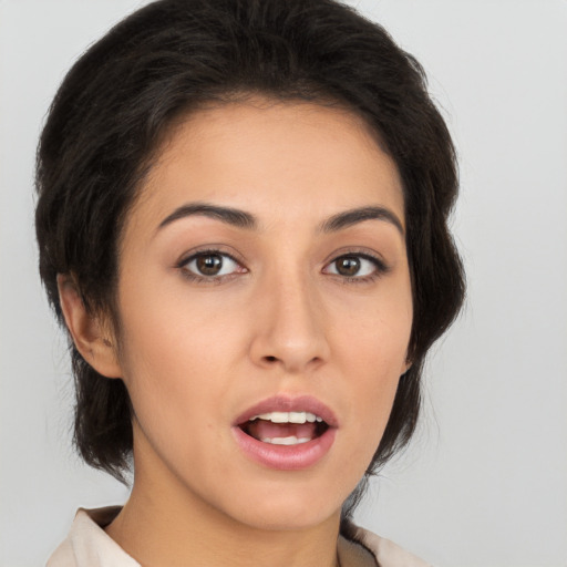 Joyful white young-adult female with medium  brown hair and brown eyes