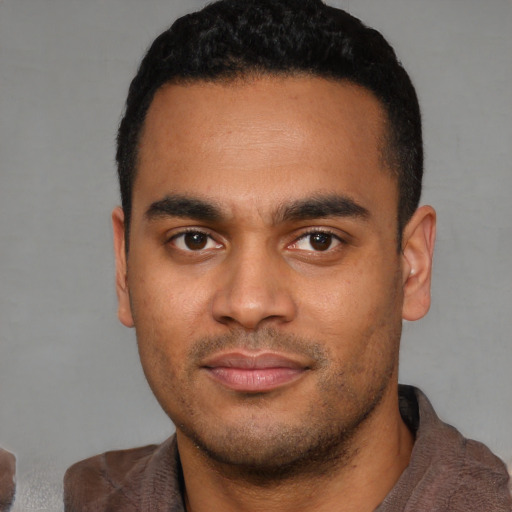 Neutral latino young-adult male with short  black hair and brown eyes