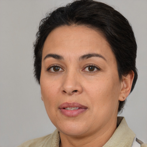 Joyful white adult female with short  brown hair and brown eyes