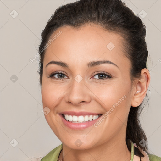 Joyful white young-adult female with medium  brown hair and brown eyes