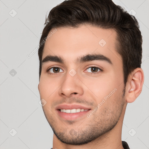 Joyful white young-adult male with short  brown hair and brown eyes