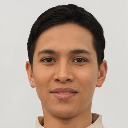 Joyful latino young-adult male with short  brown hair and brown eyes