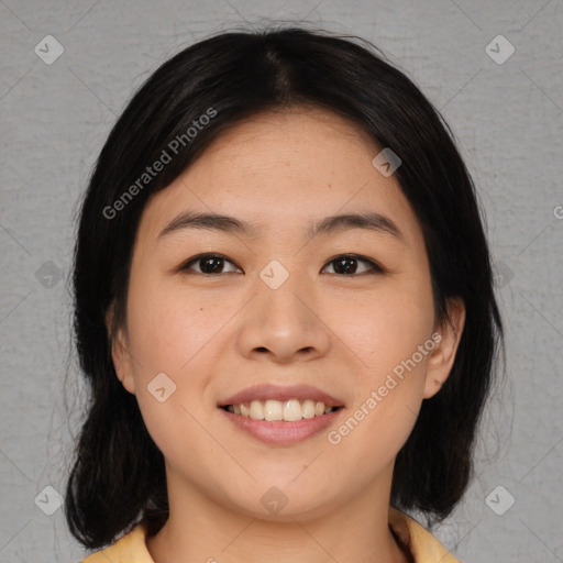 Joyful asian young-adult female with medium  black hair and brown eyes