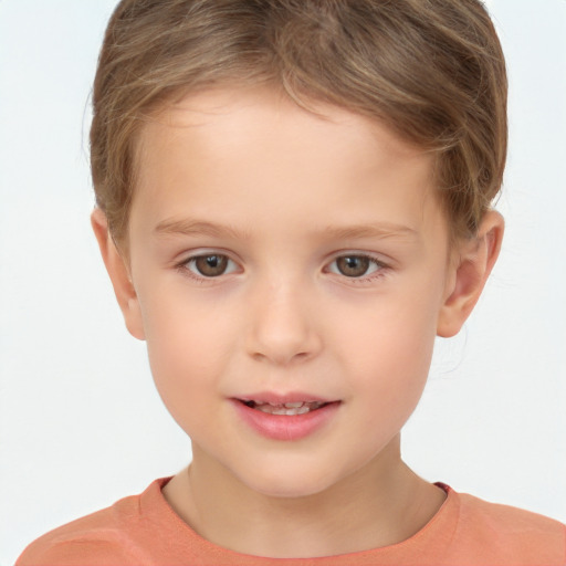 Joyful white child male with short  brown hair and brown eyes