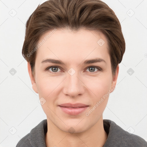 Joyful white young-adult female with short  brown hair and grey eyes