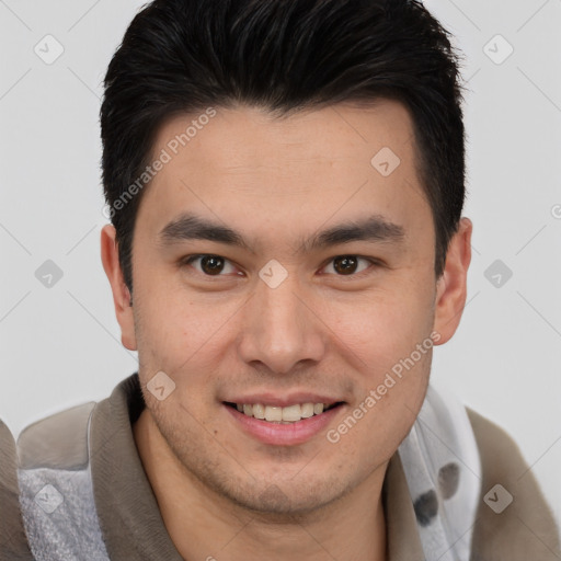 Joyful asian young-adult male with short  brown hair and brown eyes