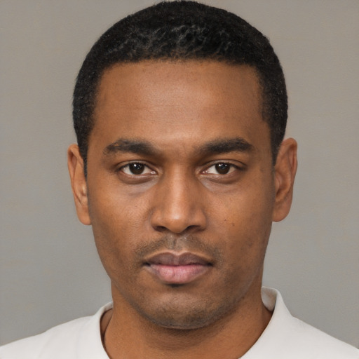Neutral black young-adult male with short  black hair and brown eyes