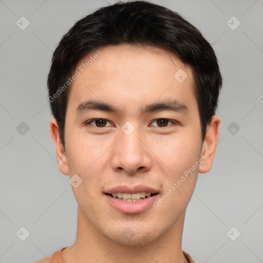 Joyful asian young-adult male with short  brown hair and brown eyes