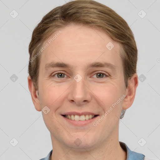 Joyful white adult male with short  brown hair and grey eyes