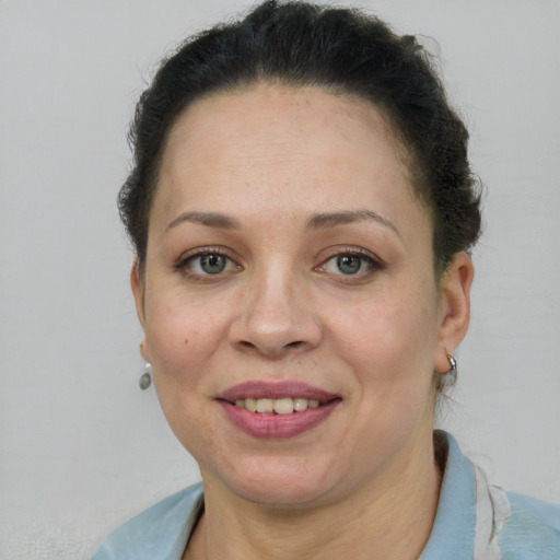 Joyful white adult female with short  brown hair and brown eyes