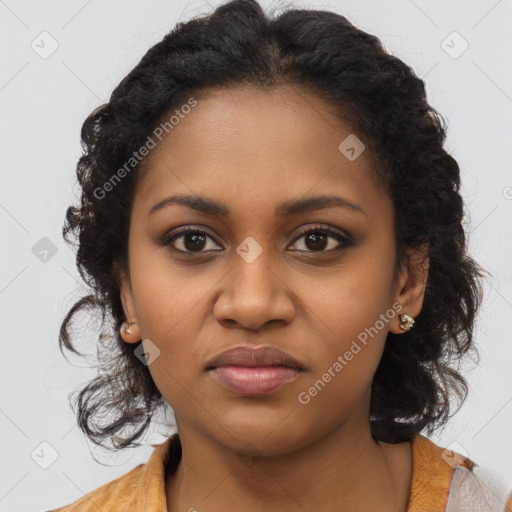 Joyful black young-adult female with long  brown hair and brown eyes