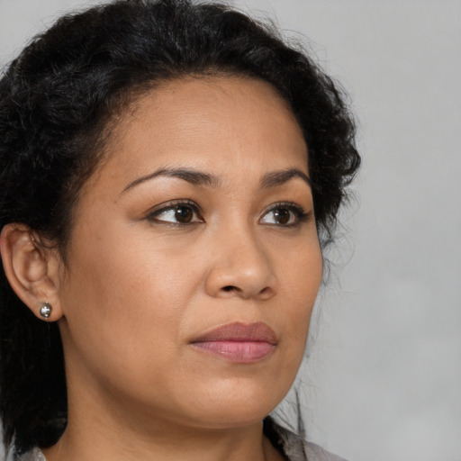 Neutral latino young-adult female with medium  brown hair and brown eyes