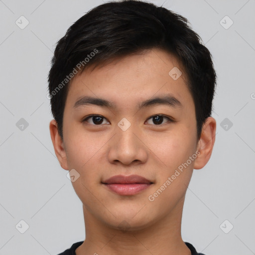 Joyful asian young-adult male with short  black hair and brown eyes