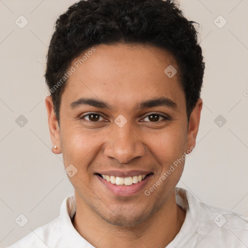 Joyful latino young-adult male with short  brown hair and brown eyes