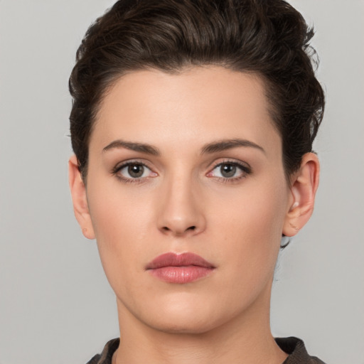 Neutral white young-adult female with short  brown hair and brown eyes