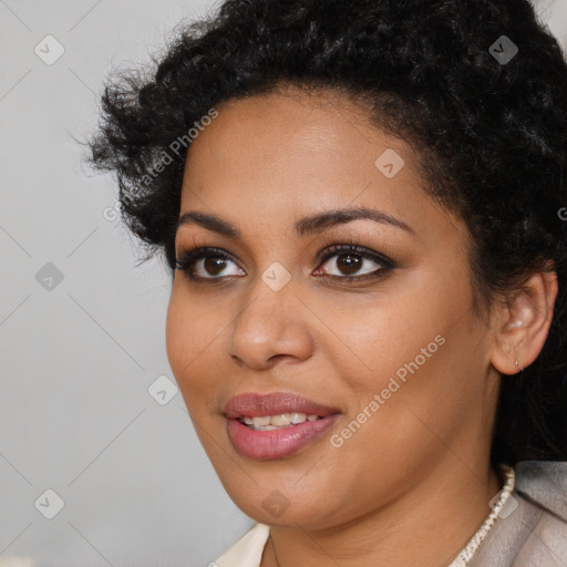 Joyful latino young-adult female with short  black hair and brown eyes