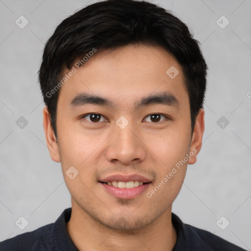 Joyful white young-adult male with short  black hair and brown eyes