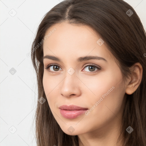 Neutral white young-adult female with long  brown hair and brown eyes