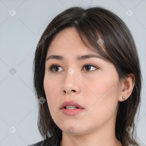 Neutral white young-adult female with medium  brown hair and brown eyes