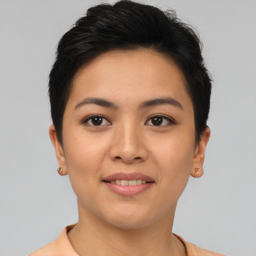 Joyful asian young-adult female with short  brown hair and brown eyes