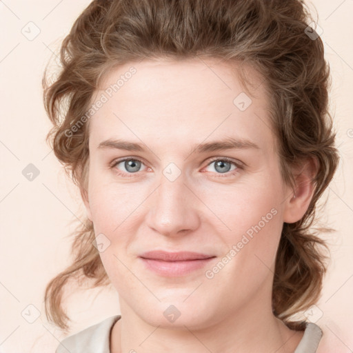 Joyful white young-adult female with medium  brown hair and green eyes