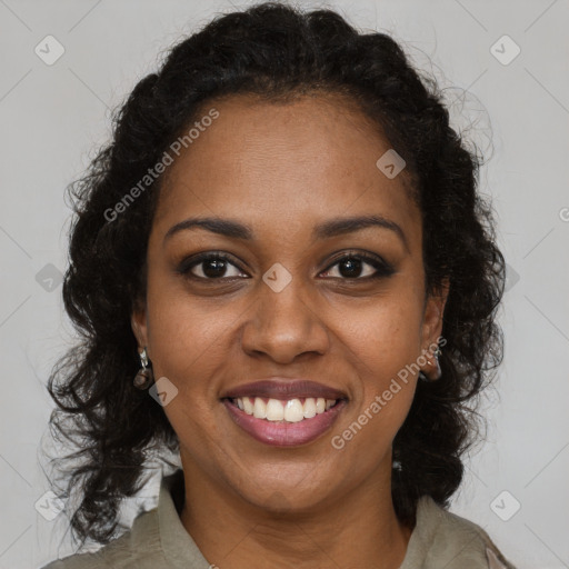 Joyful black young-adult female with long  brown hair and brown eyes