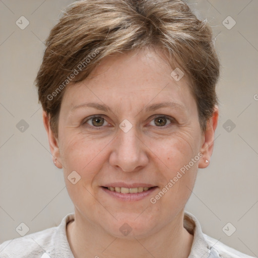 Joyful white adult female with short  brown hair and grey eyes