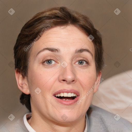 Joyful white adult female with short  brown hair and grey eyes