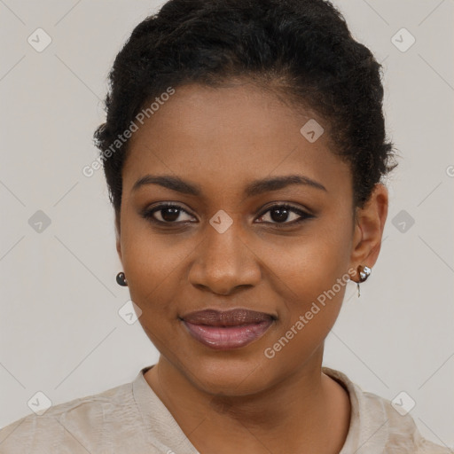 Joyful black young-adult female with short  black hair and brown eyes