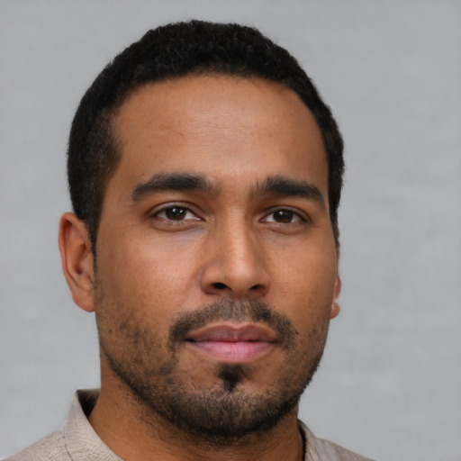 Neutral latino young-adult male with short  brown hair and brown eyes
