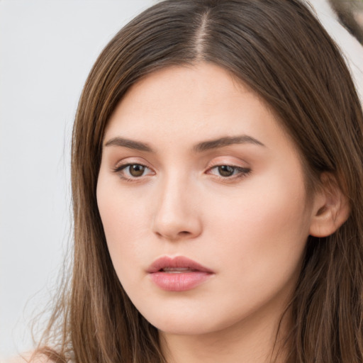 Neutral white young-adult female with long  brown hair and brown eyes