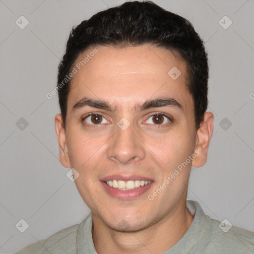 Joyful white young-adult male with short  black hair and brown eyes