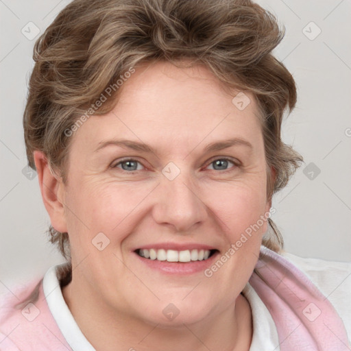 Joyful white adult female with medium  brown hair and blue eyes