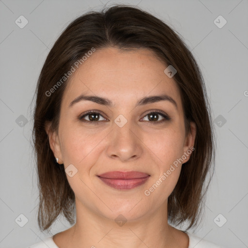 Joyful white young-adult female with medium  brown hair and brown eyes