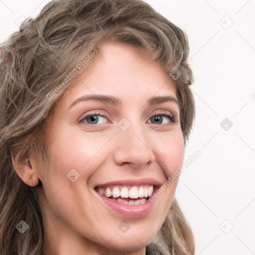 Joyful white young-adult female with long  brown hair and green eyes