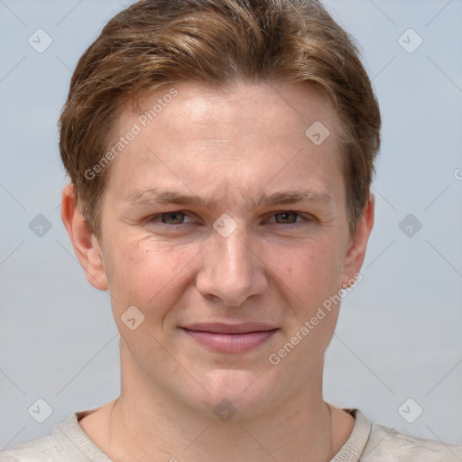 Joyful white adult male with short  brown hair and grey eyes