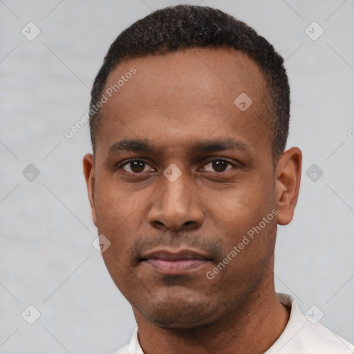 Neutral latino young-adult male with short  black hair and brown eyes