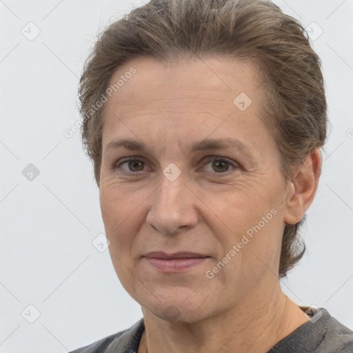 Joyful white adult female with short  brown hair and brown eyes