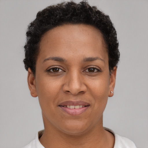 Joyful latino young-adult female with short  brown hair and brown eyes