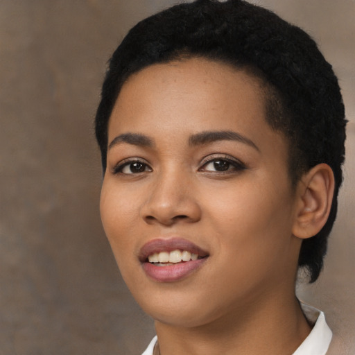 Joyful latino young-adult female with short  black hair and brown eyes