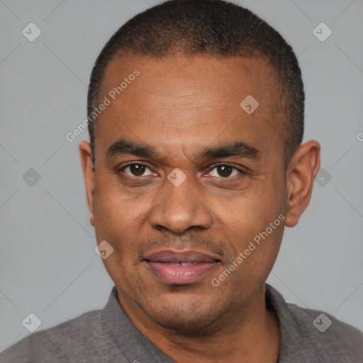 Joyful black adult male with short  black hair and brown eyes