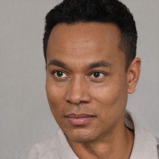 Neutral latino young-adult male with short  black hair and brown eyes